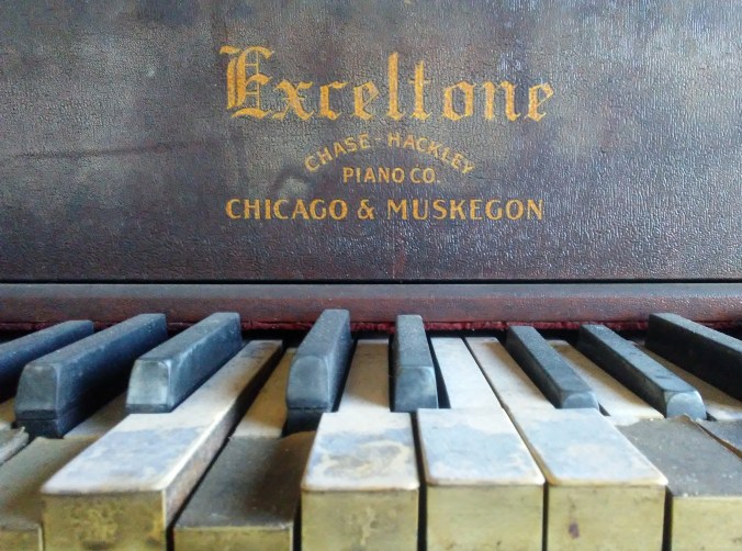 old dusty player piano stopped mid-song